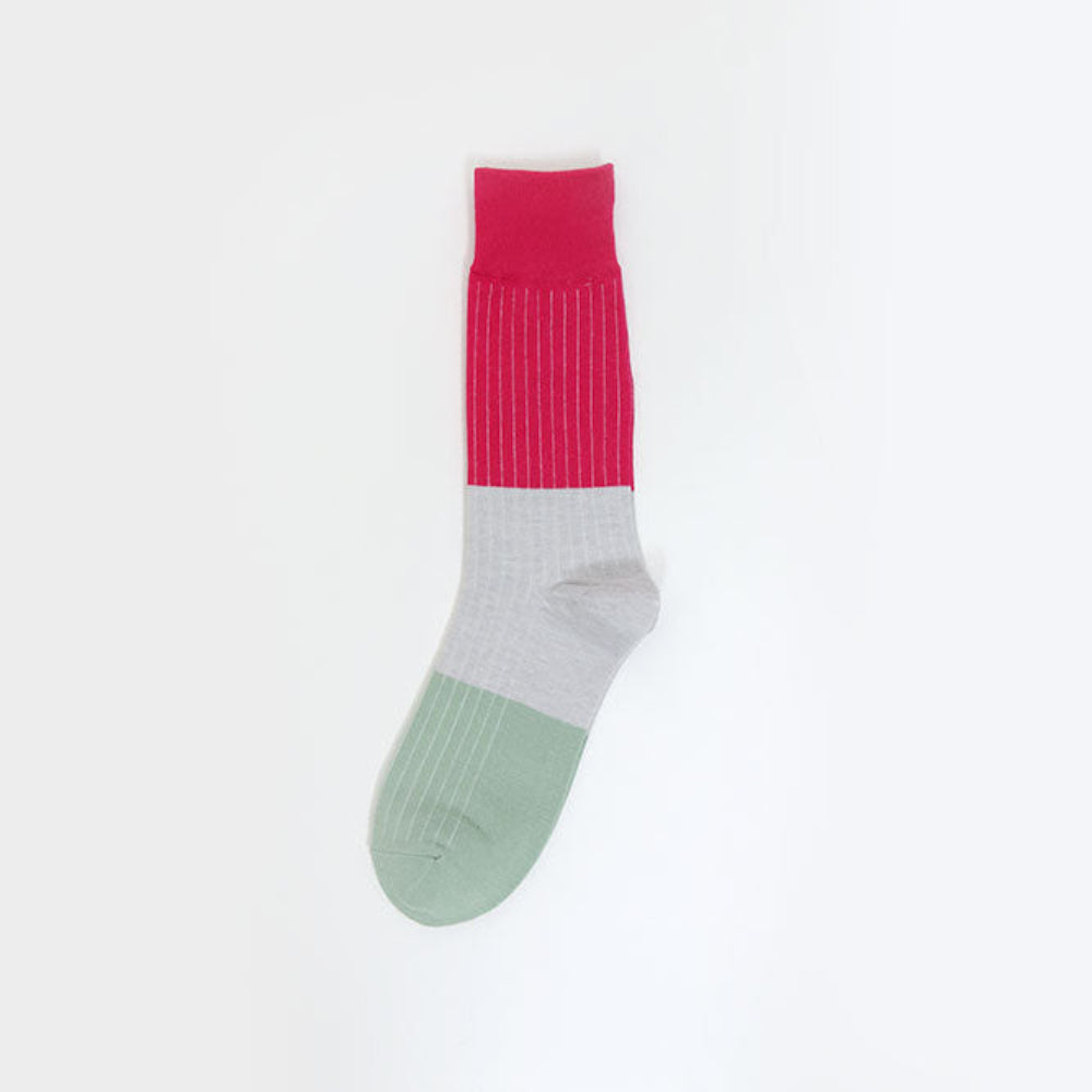 A single color-blocked sock with a bright pink ribbed cuff, a light gray midsection, and a sage green toe, shown against a plain white background.