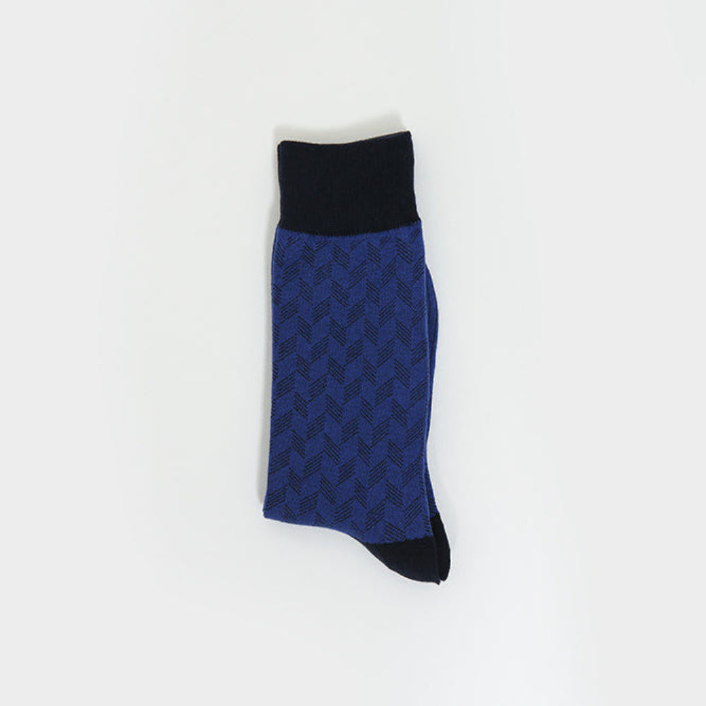 A single blue and black patterned sock with a solid black cuff and toe, displayed vertically on a clean white background.