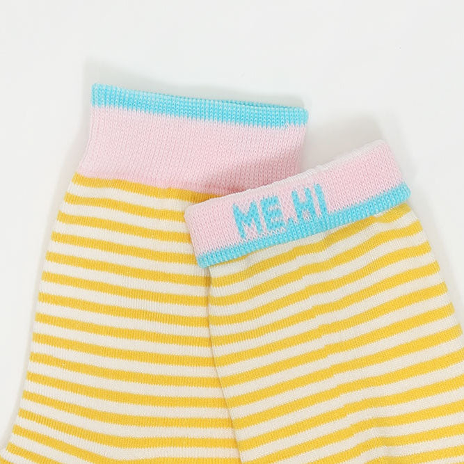 Yellow and white striped knit pet shorts with a pink waistband and light blue trim, featuring the text 'ME, HI' on the front.