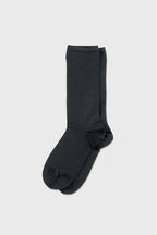 A pair of dark charcoal gray crew socks displayed flat against a light gray background.