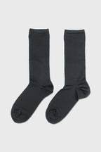 A pair of dark charcoal gray crew socks displayed flat against a light gray background.