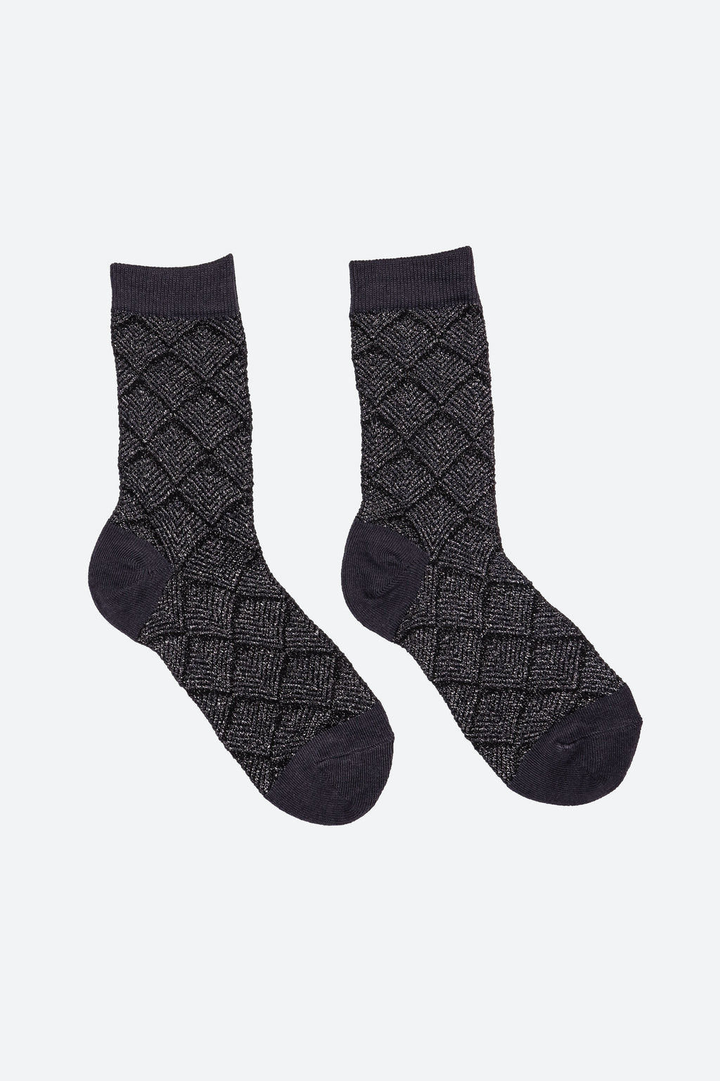 A pair of dark charcoal gray crew socks with a textured diamond argyle pattern and solid dark cuffs, heels, and toes, displayed on a light gray background.
