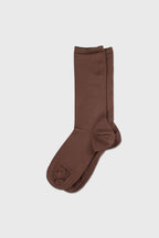 A pair of knee-high brown socks displayed flat against a light gray background.