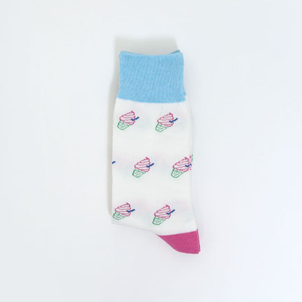 A single white sock with a light blue ribbed cuff, pink toe cap, and small pastel cupcake prints, shown on a plain white background.