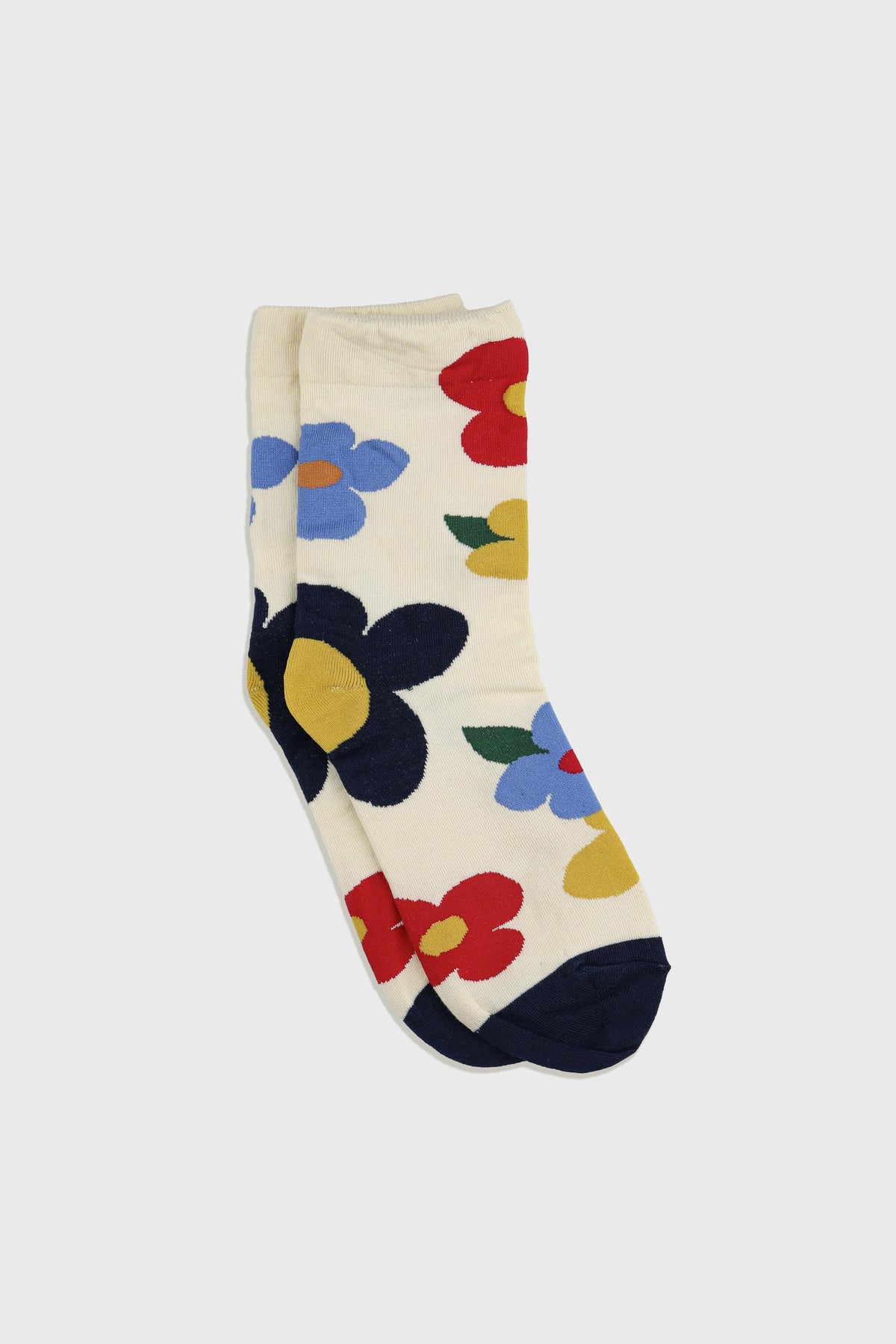 Women's Premium Combed Cotton Floral Crew Socks Ivory-A pair of cream-colored crew socks featuring a bold, colorful floral pattern with navy, red, blue, yellow, and green flowers, displayed on a light gray background.
