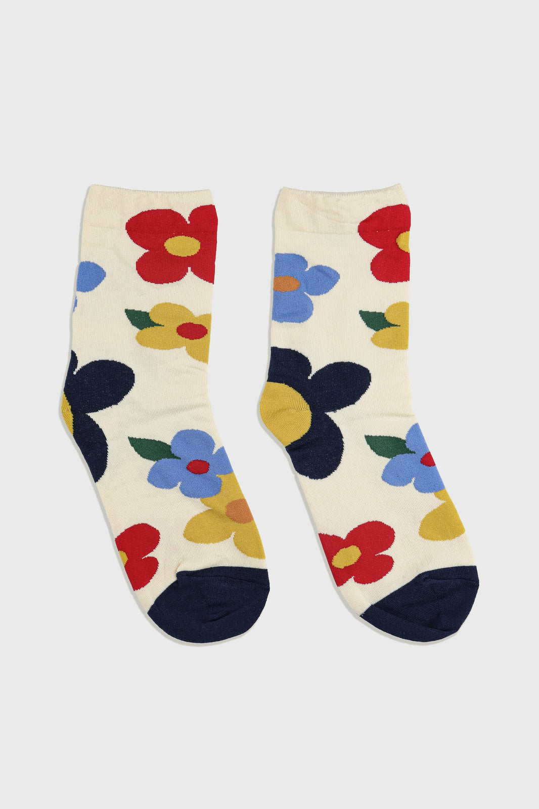 Women's Premium Combed Cotton Floral Crew Socks Ivory-A pair of cream-colored crew socks with a colorful floral pattern, featuring red, blue, yellow, and navy blue flowers with green leaves, shown against a light gray background.