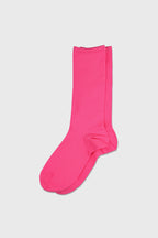 A single bright pink crew sock displayed flat against a light gray background.