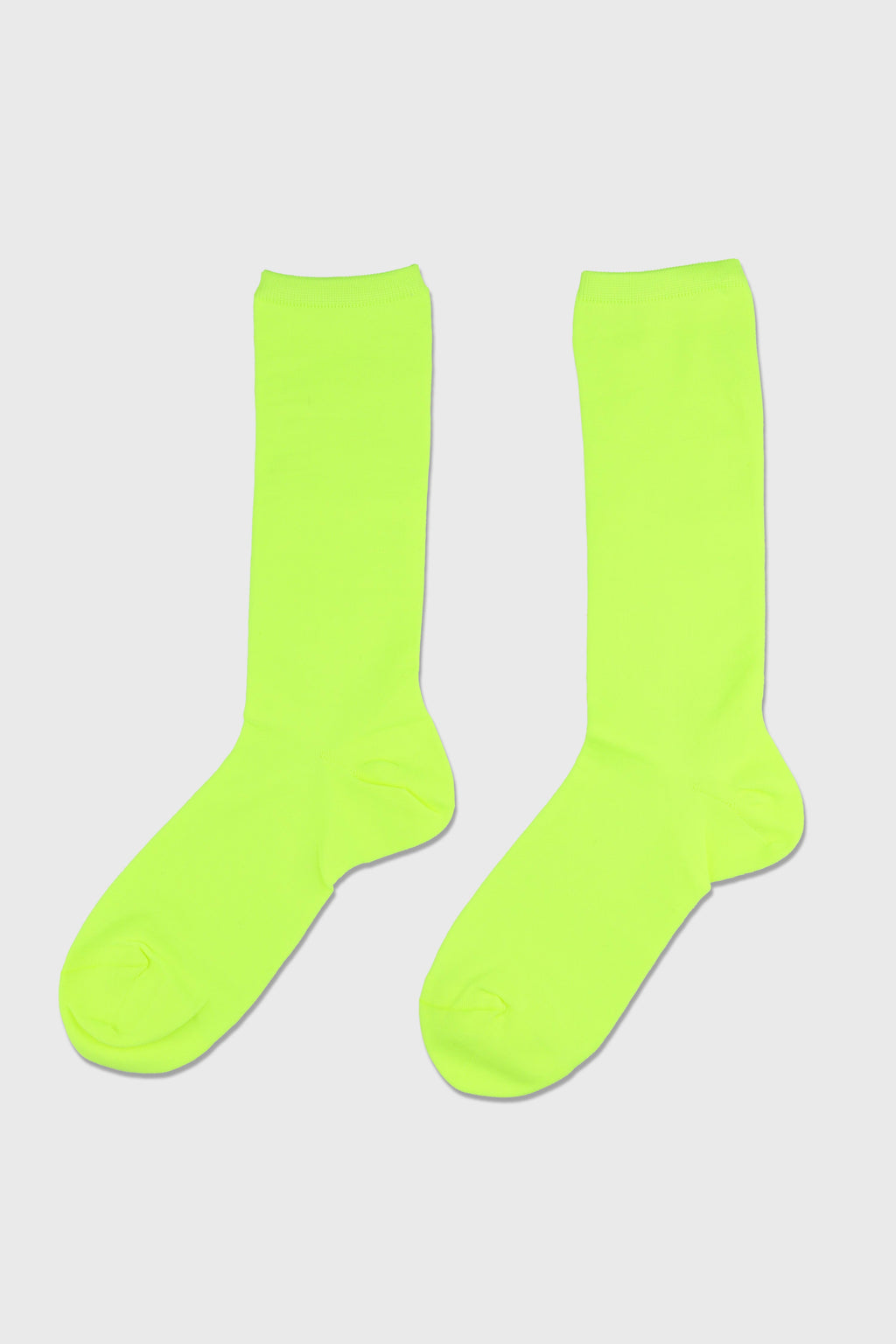 A pair of bright neon yellow-green crew socks displayed flat against a light gray background.