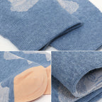 Close-up product collage of folded blue knit socks with a tonal abstract face pattern and a peach-colored toe area, shown on a white background.